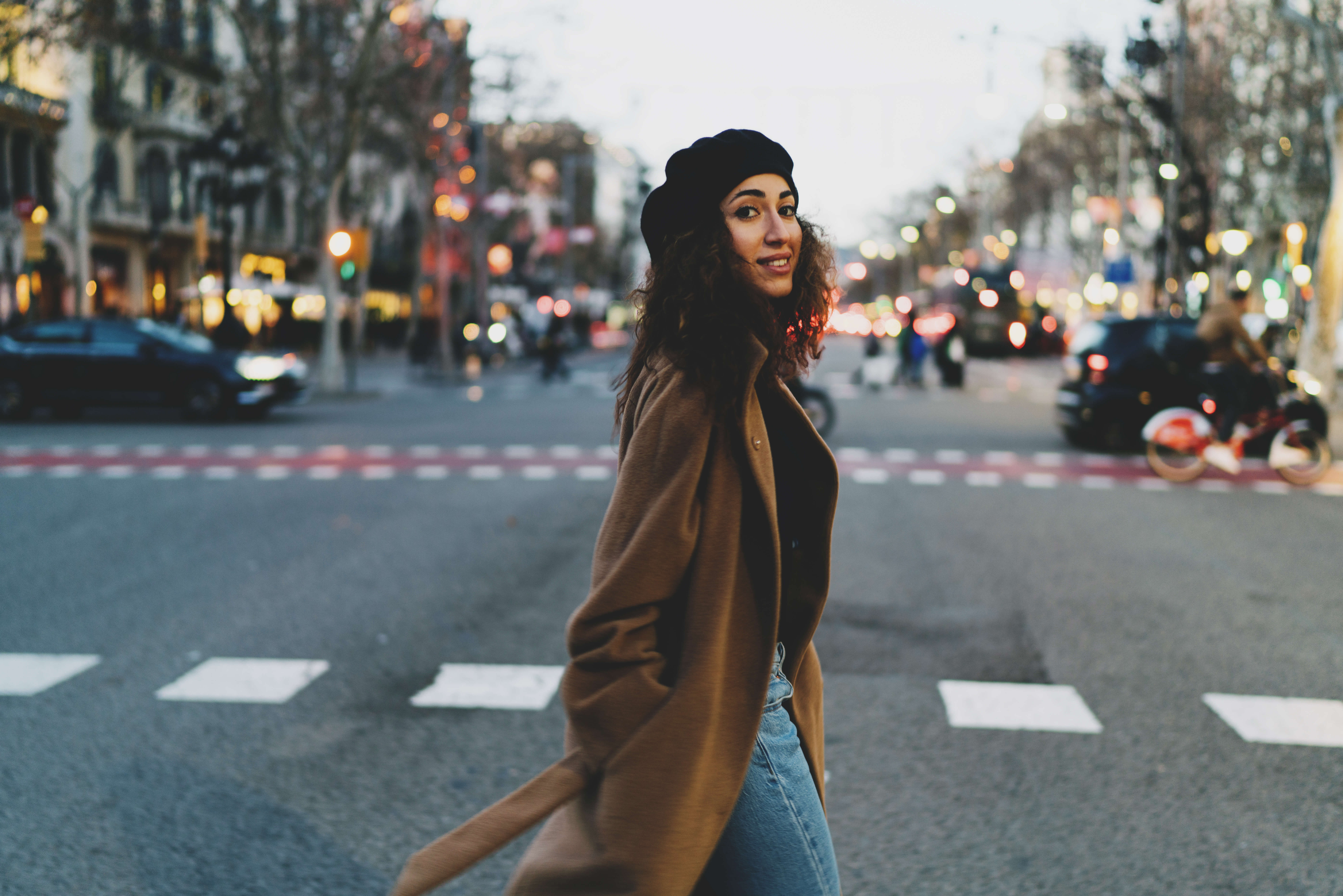young mixed woman on crosswalk in Europe